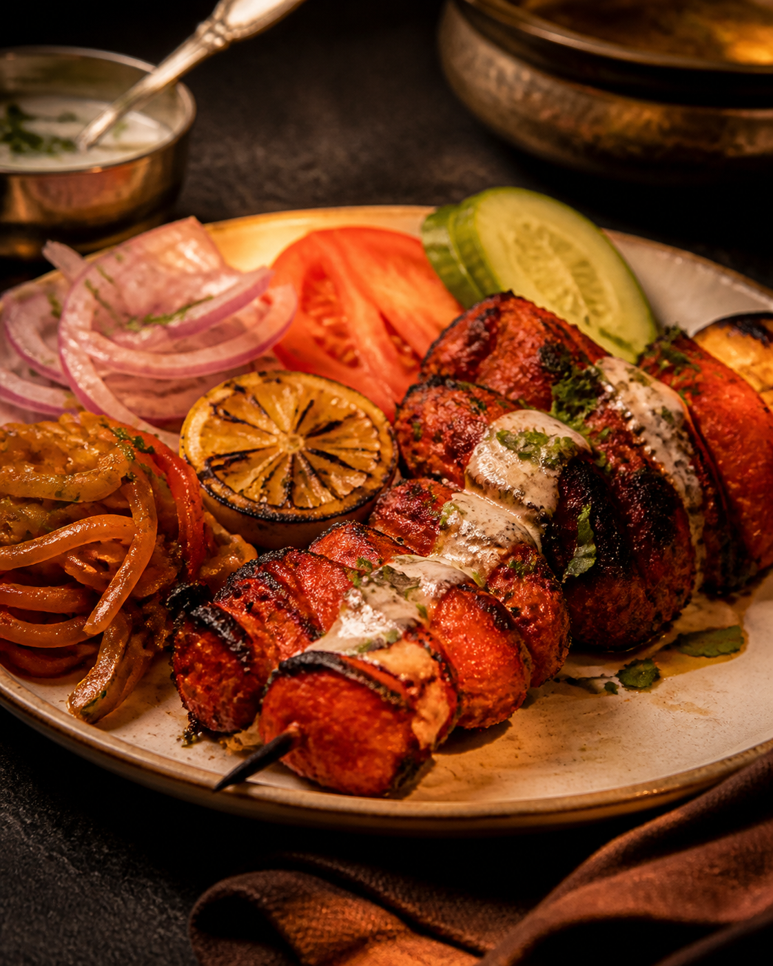 Tandoori chicken skewers with grilled lemon